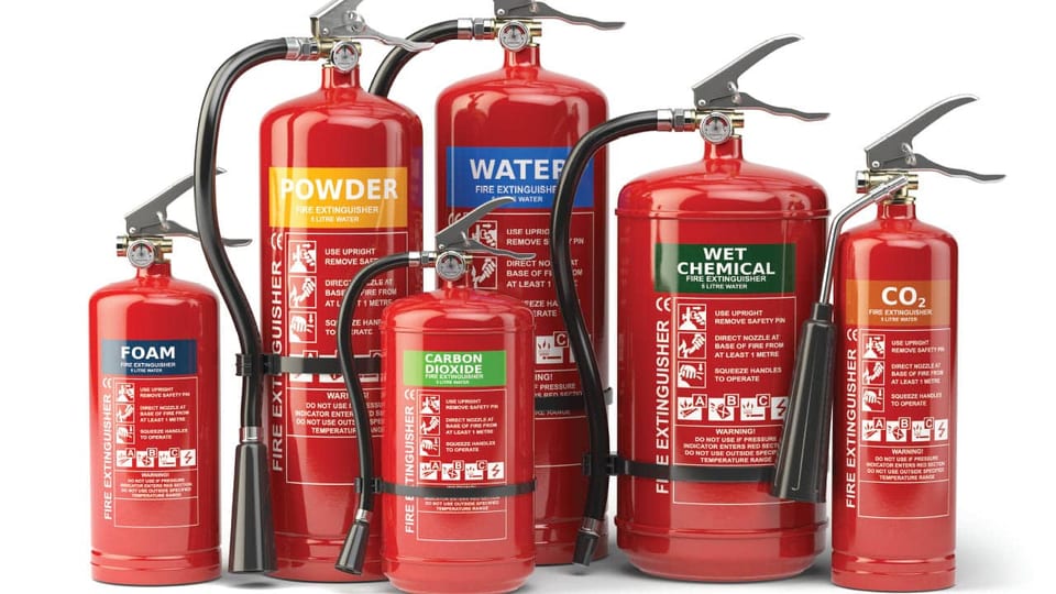 Six portable fire extinguishers of different types including foam, powder, water, wet chemical and carbon dioxide