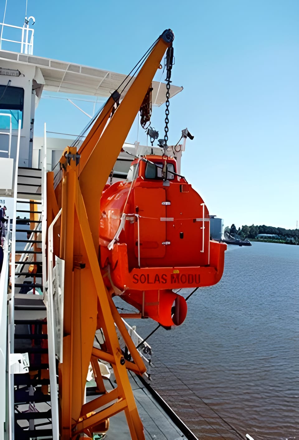 Enclosed lifeboat photographed during an early SOLAS MODU build and servicing project