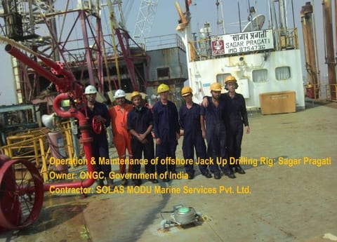 Offshore crew assembled on the pipe deck of a jack-up drilling rig during an operations and maintenance campaign