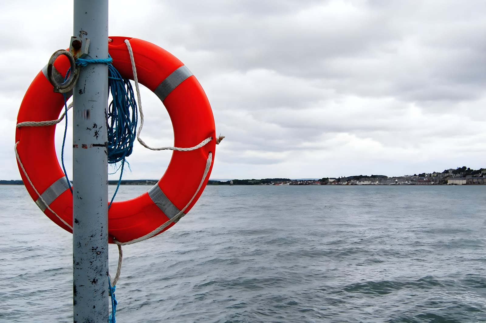 Lifebuoy with reflective tape secured on deck