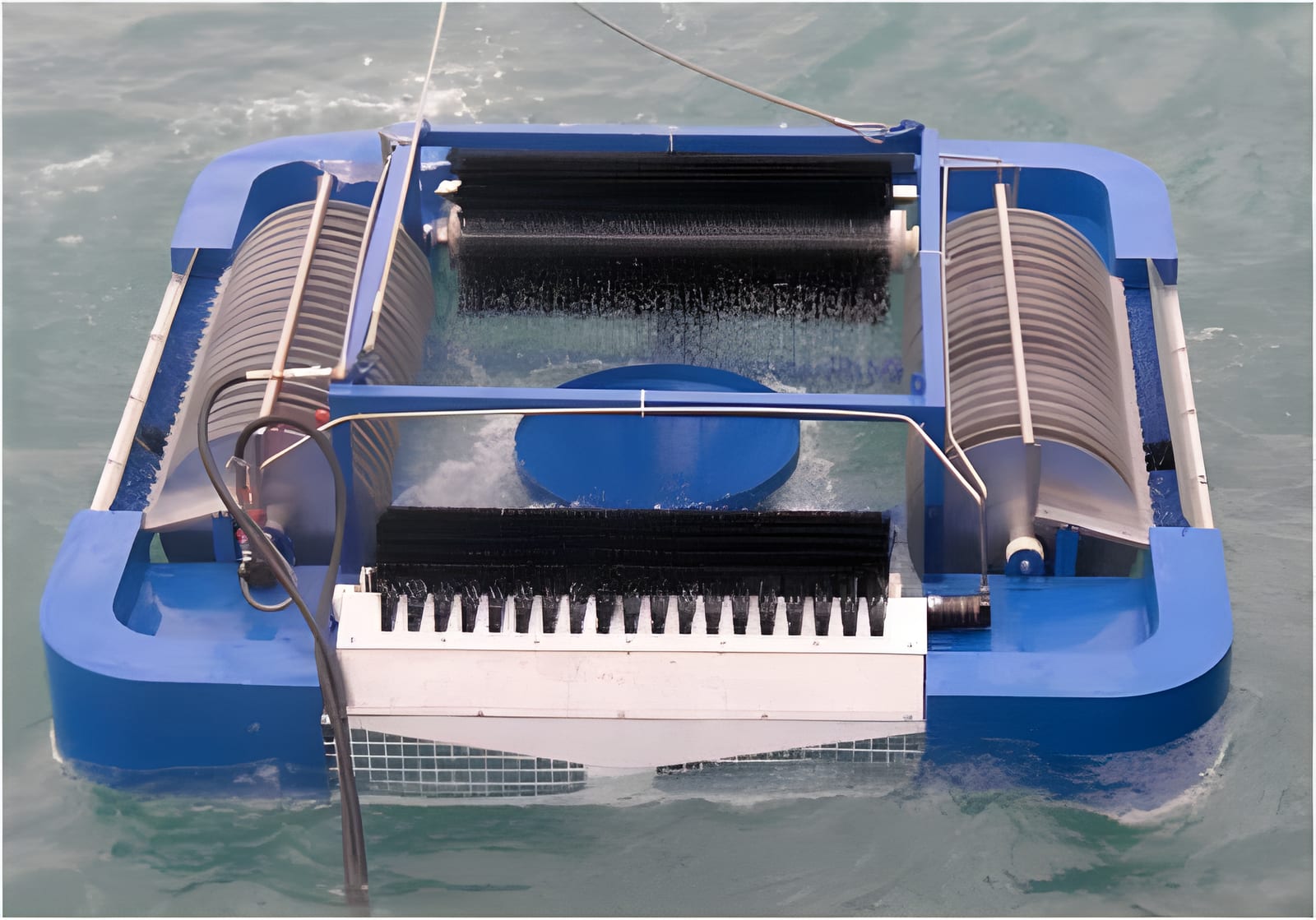 Oil skimmer recovering surface oil from the water